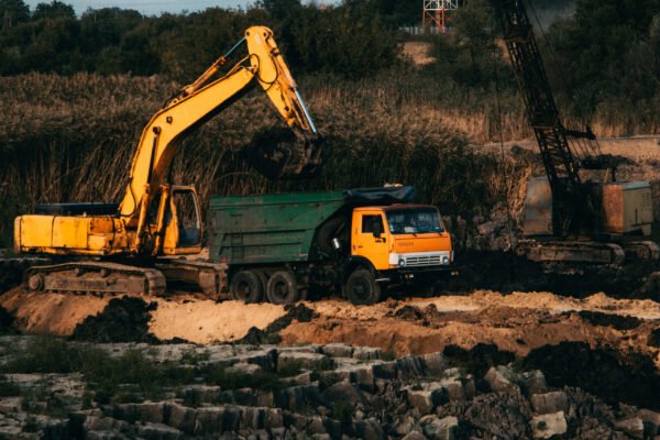 closeup-shot-ongoing-construction-with-tracks-bulldozer-abandoned-land (1)